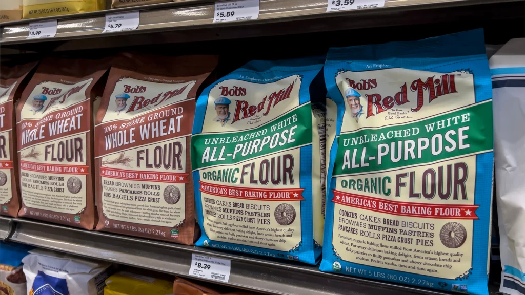 Close up view of Bob's Red Mill brand flour for sale inside a Town and Country Market.