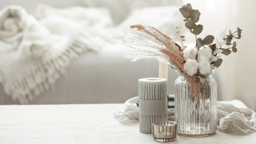 vase and candles on a table