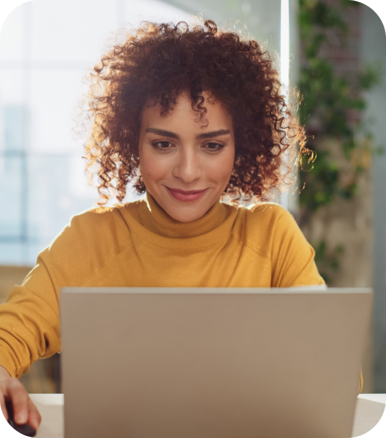 A social media manager logs into their laptop