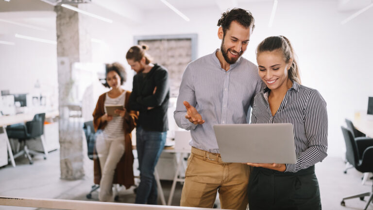 Team looking at growth reports and understanding how to maximise their ROI via social media