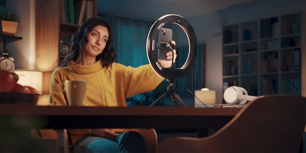 UGC Creator in front of a phone camera and ring light