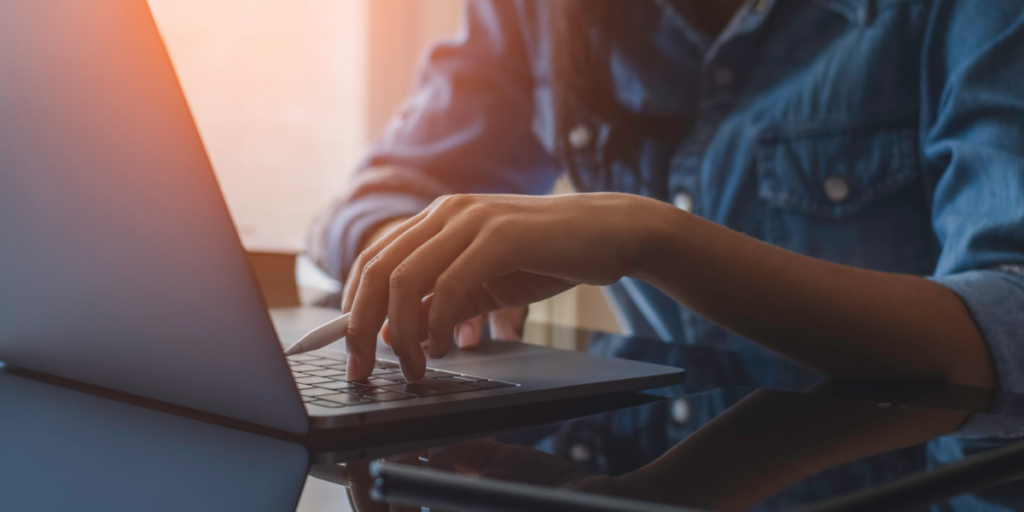Customer agent typing on laptop