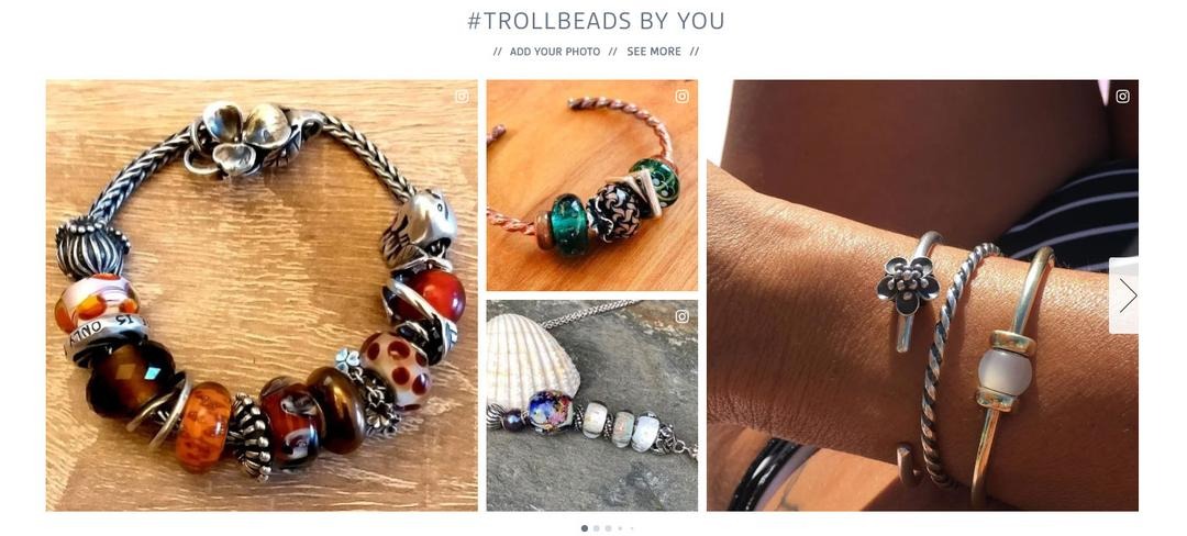Trollbeads website gallery titled #Trollbeads by you, with Add your photo and See more links above customer photographs of beaded bracelets and bangles, each marked with an Instagram icon